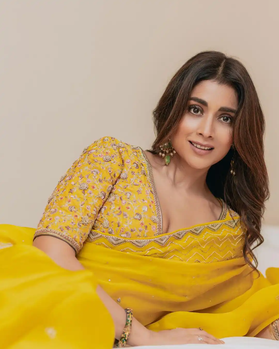 Heroine Shriya Saran Cute looking Photos in Yellow Saree